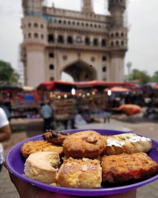 Nimrah Cafe and Bakery with Charminar at the backdrop